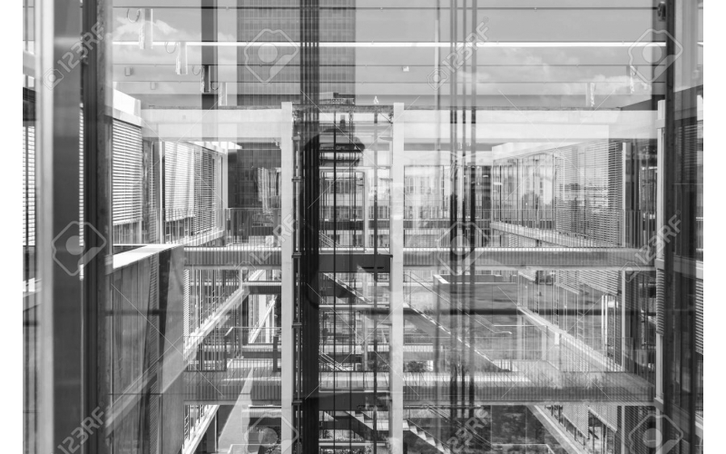 127128593-abstract-window-reflections-in-morden-office-building-contemporary-corporate-business-arch